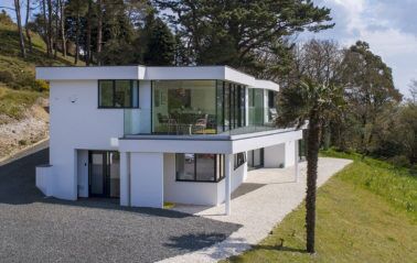 Full height fixed window complements first floor sliding door installation