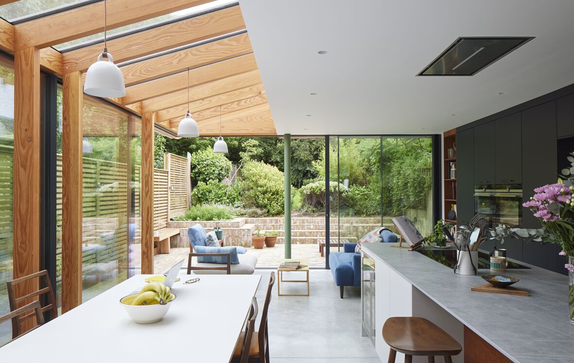 Interior of side return extension with full height glass corner sliding doors